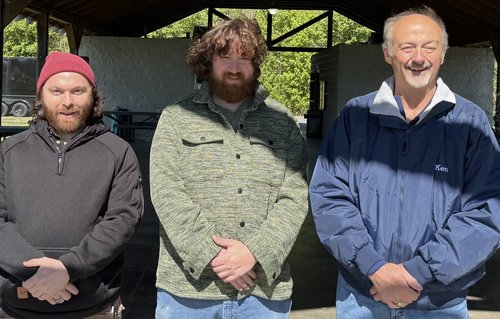 Three Lodge members and volunteers at the event