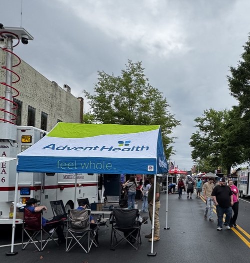 AdventHealth tent set up along the street festival