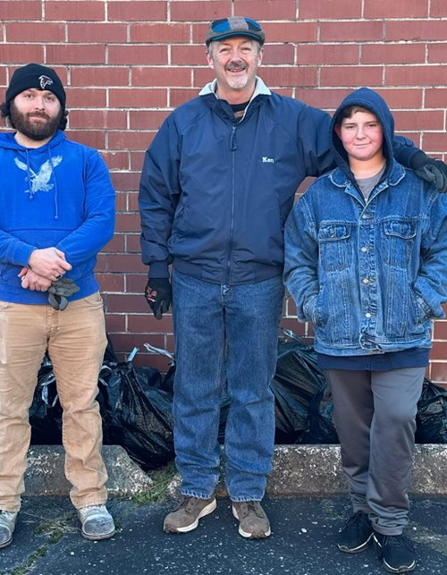 Three Lodge members after an Adopt-A-Highway litter clean-up