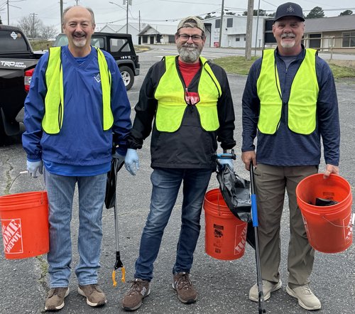Three Lodge members with clean-up buckets before the Adopt-A-Highway clean-up