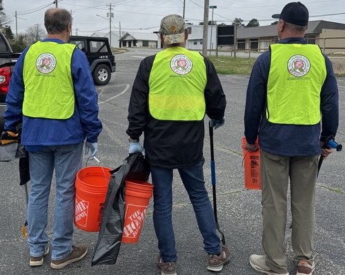 Lodge members wearing Keep Calhoun Gordon Beautiful vests during the clean-up