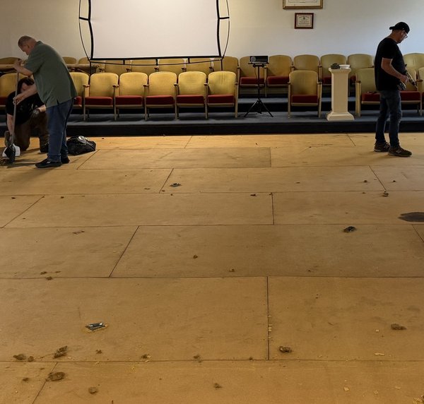 Lodge members cleaning the Lodge room floor