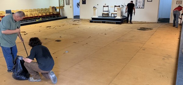 Lodge members cleaning the Lodge room floor