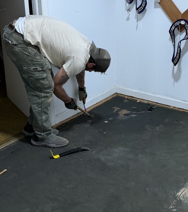 Lodge member prepping the floor for new flooring
