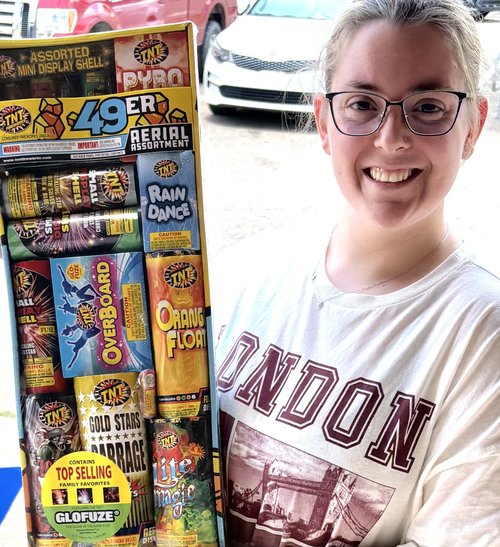 Lodge member with a display of TNT Fireworks assortments