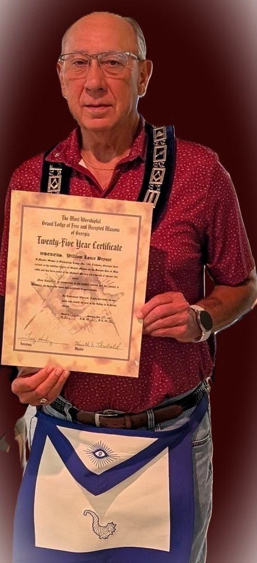 William Lance Bryant holding his 25-Year Certificate from the Grand Lodge of Georgia